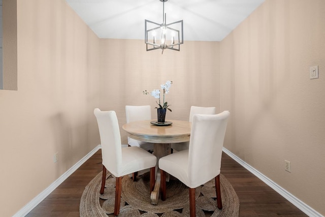 8200 Neely Dr Unit 217, Austin, TX 78759 - dining area with a chandelier, dark wood finished floors, and baseboards