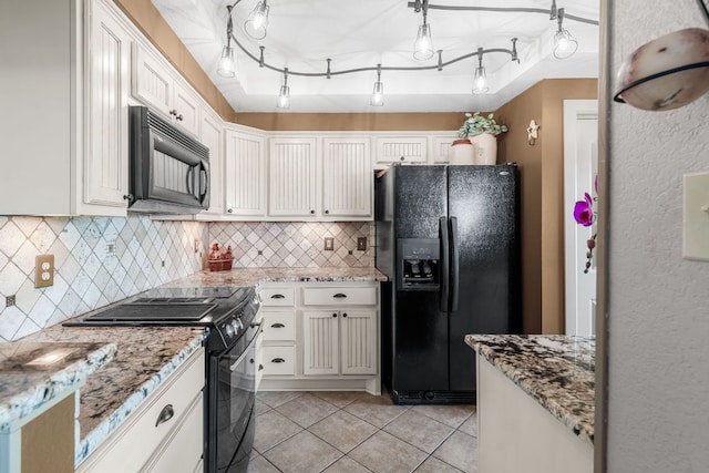 8200 Neely Dr Unit 217, Austin, TX 78759 - kitchen with black appliances, backsplash, light tile patterned floors, white cabinetry, and light stone countertops
