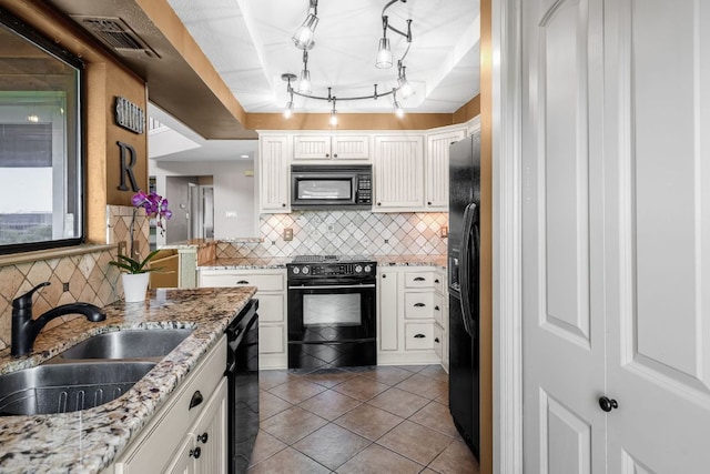 8200 Neely Dr Unit 217, Austin, TX 78759 - kitchen featuring black appliances, a sink, white cabinetry, and decorative backsplash