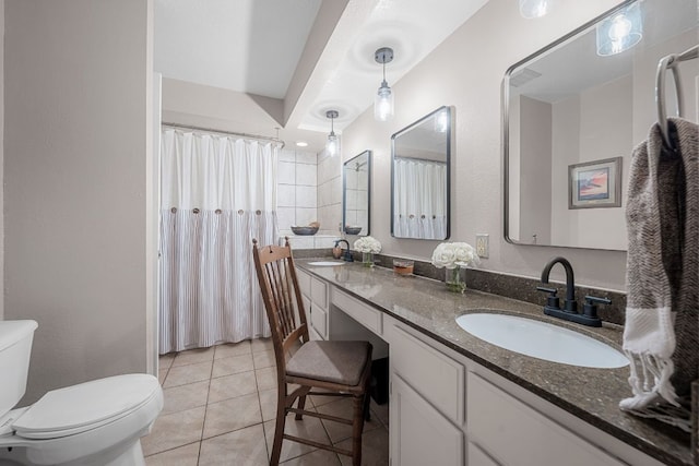 8200 Neely Dr Unit 217, Austin, TX 78759 - bathroom featuring toilet, double vanity, tile patterned flooring, and a shower with curtain
