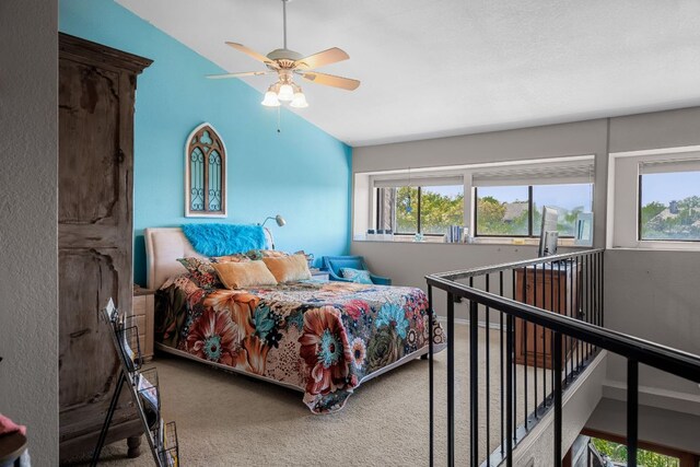 8200 Neely Dr Unit 217, Austin, TX 78759 - bedroom featuring multiple windows, carpet, lofted ceiling, and a ceiling fan