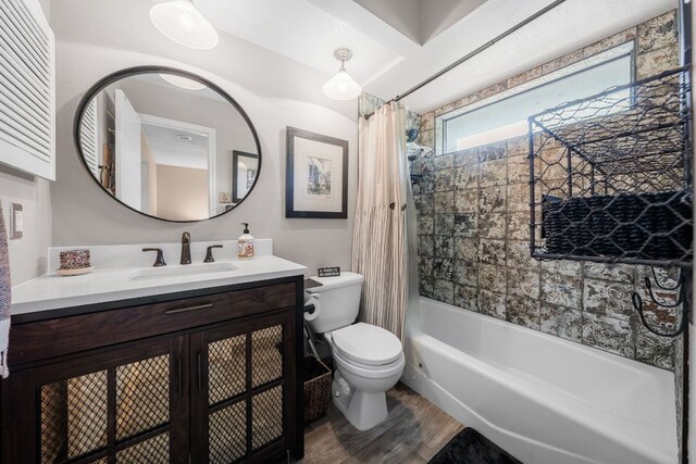 8200 Neely Dr Unit 217, Austin, TX 78759 - full bathroom featuring wood finished floors, toilet, vanity, and shower / bath combination with curtain