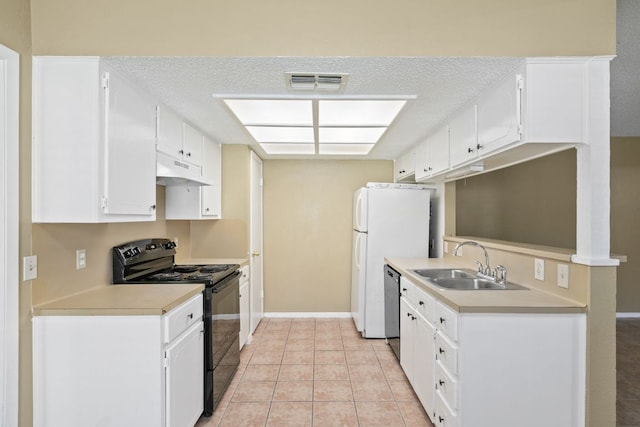 kitchen with light countertops, dishwasher, visible vents, a sink, and electric range