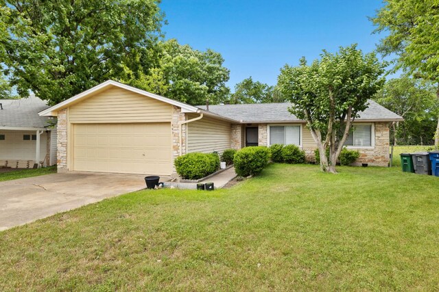 607 Elderberry Cv, Austin, TX 78745 - ranch-style house with stone siding, a garage, a front lawn, and driveway