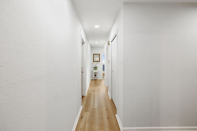 607 Elderberry Cv, Austin, TX 78745 - corridor featuring light wood-style floors, recessed lighting, and baseboards