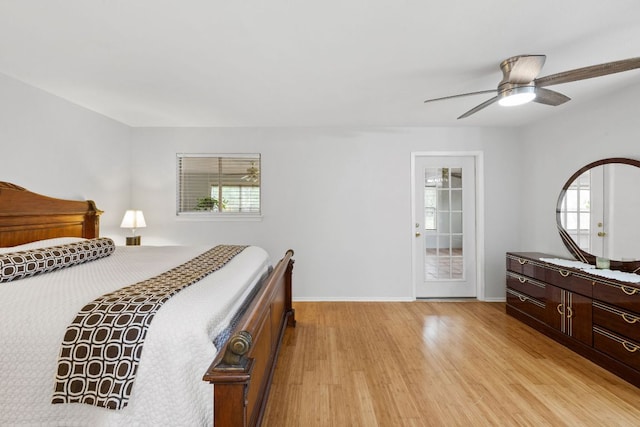 607 Elderberry Cv, Austin, TX 78745 - bedroom featuring light wood-type flooring, baseboards, and a ceiling fan