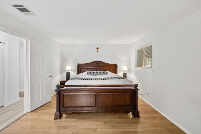 607 Elderberry Cv, Austin, TX 78745 - bedroom featuring light wood finished floors and baseboards