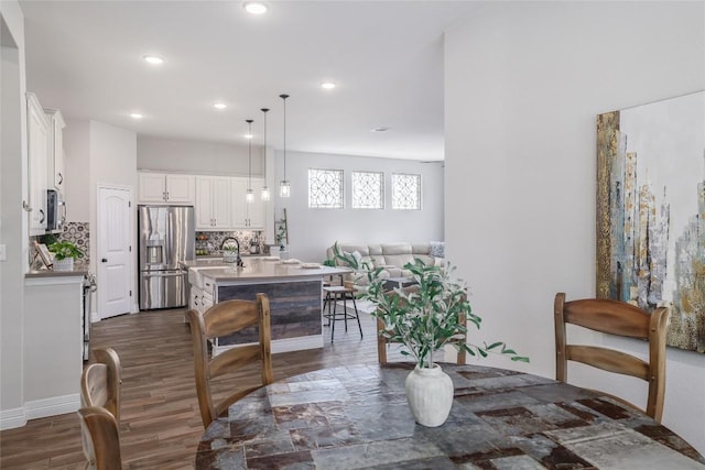 505 Saturnia Dr, Georgetown, TX 78628 - dining space featuring dark wood finished floors and recessed lighting