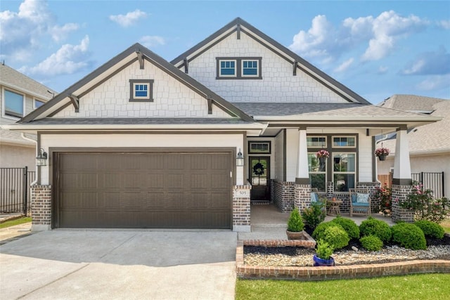 505 Saturnia Dr, Georgetown, TX 78628 - craftsman house featuring covered porch, driveway, a garage, roof with shingles, and brick siding