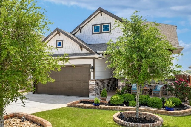 505 Saturnia Dr, Georgetown, TX 78628 - craftsman-style house featuring roof with shingles, brick siding, a front yard, and driveway