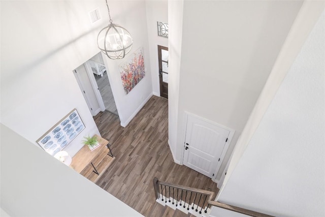 505 Saturnia Dr, Georgetown, TX 78628 - staircase featuring a chandelier, wood finished floors, and a towering ceiling