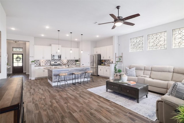 505 Saturnia Dr, Georgetown, TX 78628 - living area featuring ceiling fan, dark wood-type flooring, and recessed lighting