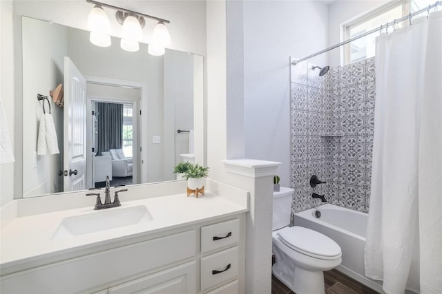 505 Saturnia Dr, Georgetown, TX 78628 - full bathroom with shower / tub combo with curtain, vanity, healthy amount of natural light, and wood finished floors
