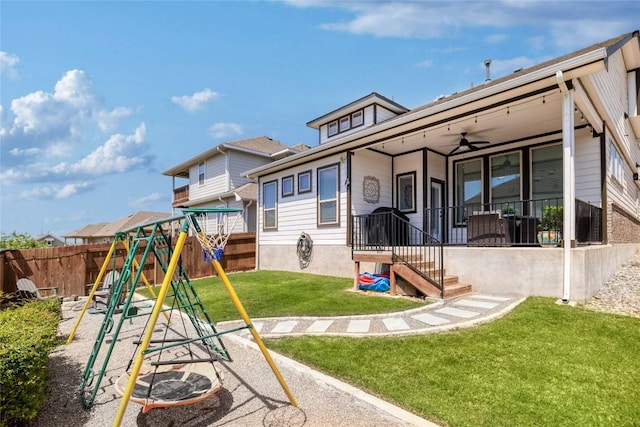 505 Saturnia Dr, Georgetown, TX 78628 - rear view of property with a playground, a fenced backyard, and a ceiling fan