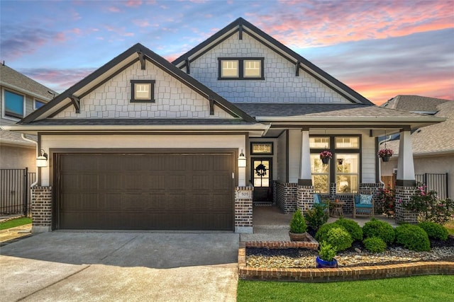 505 Saturnia Dr, Georgetown, TX 78628 - craftsman-style home with a porch, driveway, an attached garage, and a shingled roof