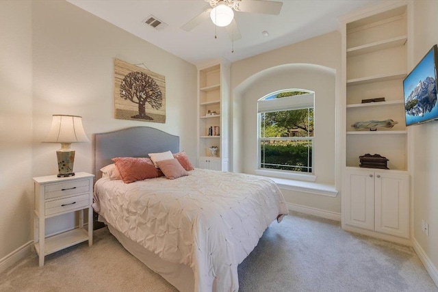 bedroom featuring light carpet, baseboards, visible vents, and a ceiling fan