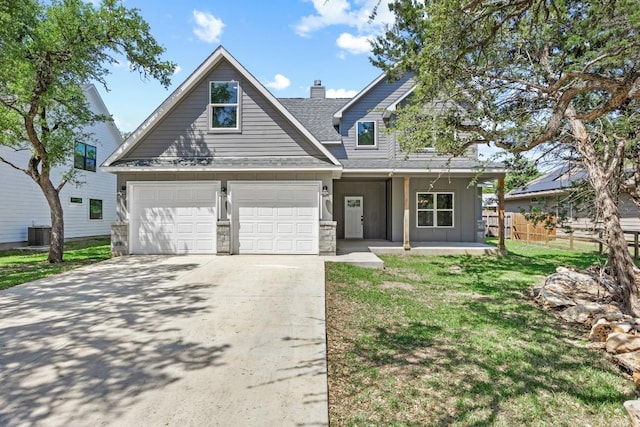 7 Harmony Ln, Wimberley, TX 78676 - view of front of house featuring concrete driveway, a chimney, a shingled roof, a porch, and stone siding