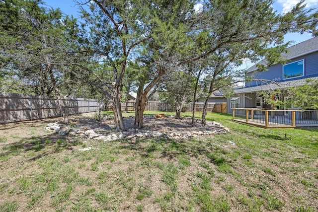 7 Harmony Ln, Wimberley, TX 78676 - fenced backyard featuring a wooden deck
