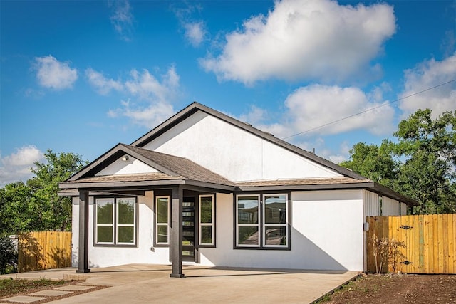 106 Passion Vine Rd, Dale, TX 78616 - back of house with fence, a patio area, and stucco siding