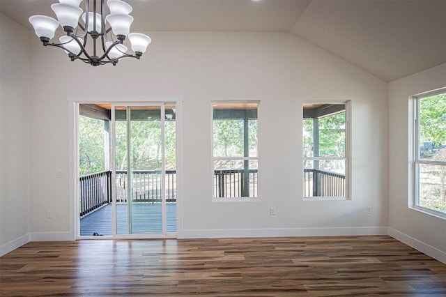 106 Passion Vine Rd, Dale, TX 78616 - unfurnished room with wood finished floors, a chandelier, and vaulted ceiling