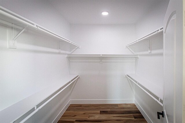 106 Passion Vine Rd, Dale, TX 78616 - walk in closet featuring wood finished floors