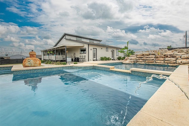 171 Milagros Dr, Cedar Creek, TX 78612 - view of pool featuring a patio, a fireplace, and a pool with connected hot tub
