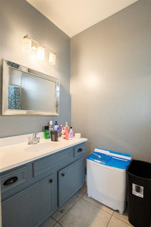 171 Milagros Dr, Cedar Creek, TX 78612 - bathroom with vanity and tile patterned floors