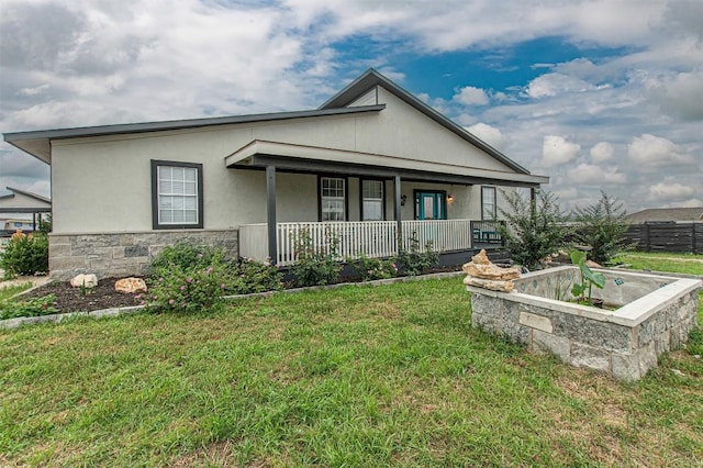 171 Milagros Dr, Cedar Creek, TX 78612 - view of front of property with a porch, stone siding, and stucco siding
