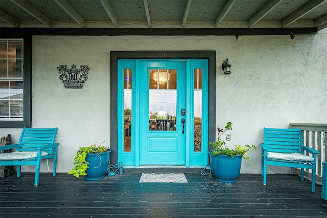 171 Milagros Dr, Cedar Creek, TX 78612 - view of exterior entry with stucco siding and a porch
