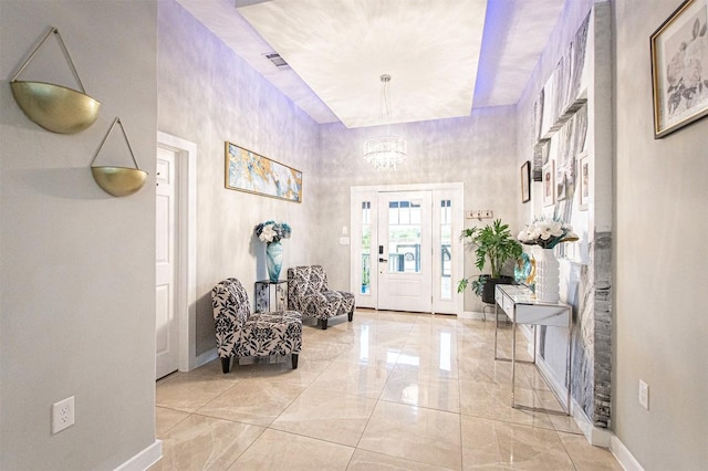 171 Milagros Dr, Cedar Creek, TX 78612 - entrance foyer featuring a chandelier and light marble finish floors