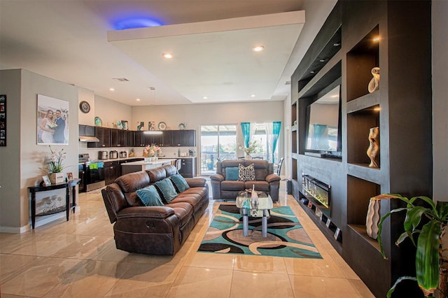 171 Milagros Dr, Cedar Creek, TX 78612 - living area with a glass covered fireplace