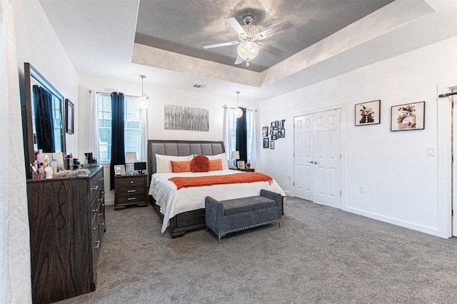 171 Milagros Dr, Cedar Creek, TX 78612 - bedroom featuring carpet flooring, a raised ceiling, and a ceiling fan