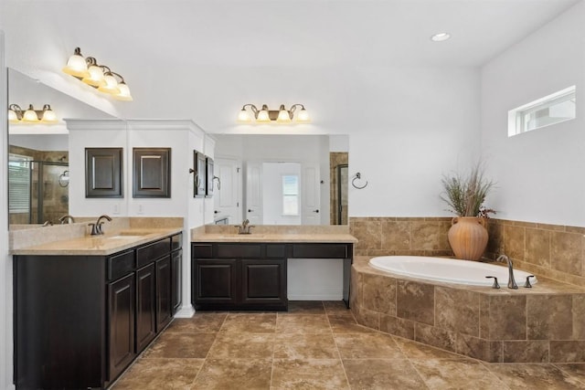 111 Antonio Way Unit 5A, Austin, TX 78734 - full bathroom with two vanities, a stall shower, and a garden tub