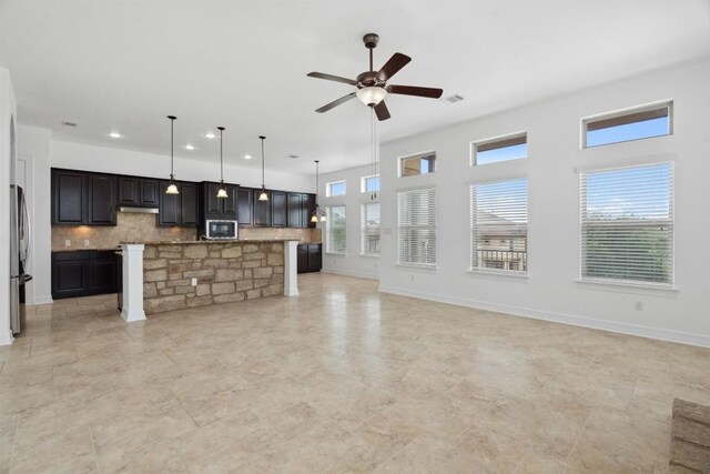 111 Antonio Way Unit 5A, Austin, TX 78734 - unfurnished living room featuring ceiling fan and recessed lighting