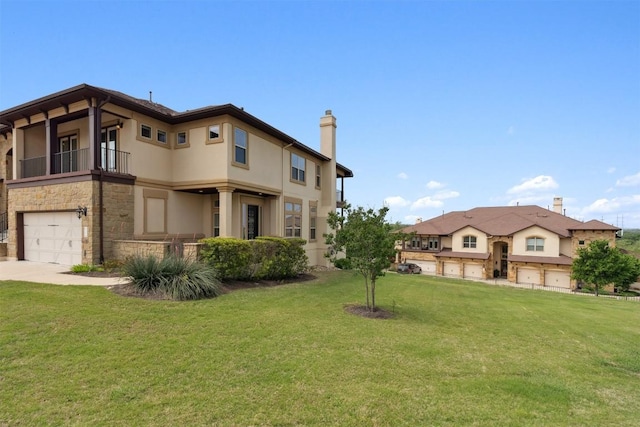 111 Antonio Way Unit 5A, Austin, TX 78734 - view of front of property with stucco siding, a balcony, a front lawn, and a garage