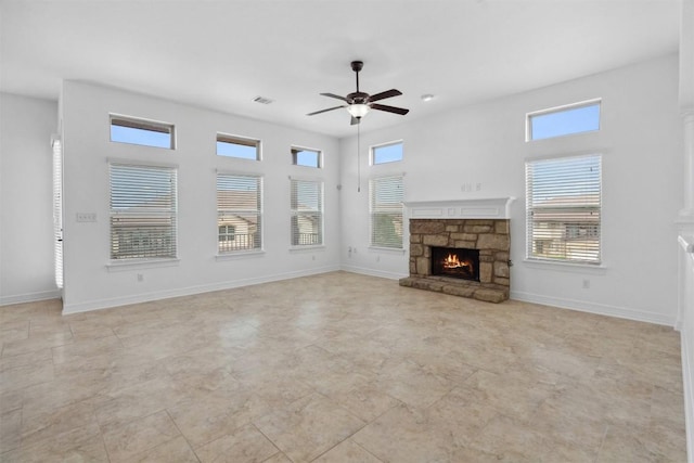 111 Antonio Way Unit 5A, Austin, TX 78734 - unfurnished living room featuring ceiling fan and a fireplace