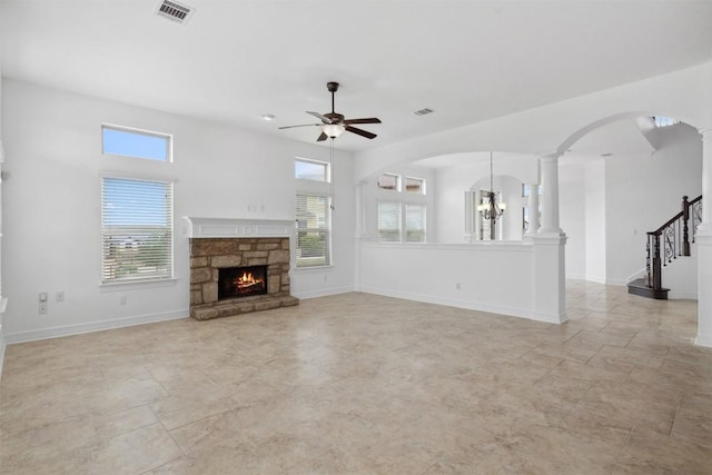 111 Antonio Way Unit 5A, Austin, TX 78734 - unfurnished living room featuring ceiling fan, plenty of natural light, a fireplace, and ornate columns