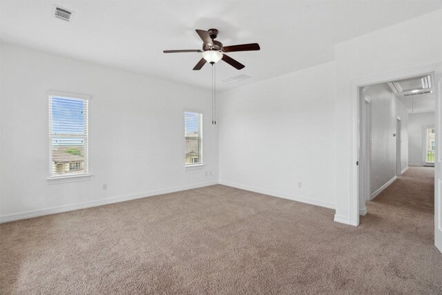 111 Antonio Way Unit 5A, Austin, TX 78734 - unfurnished room with attic access, light carpet, ceiling fan, and plenty of natural light