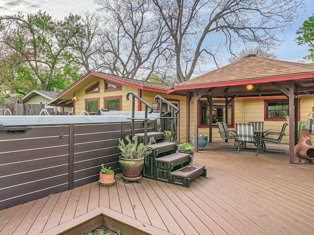 822 Hermitage Dr, Austin, TX 78753 - wooden terrace featuring a hot tub, fence, and outdoor dining space