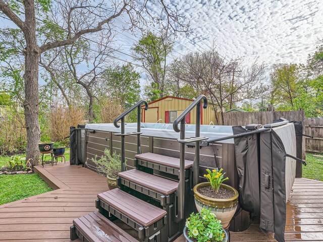822 Hermitage Dr, Austin, TX 78753 - wooden deck with a hot tub and a fenced backyard