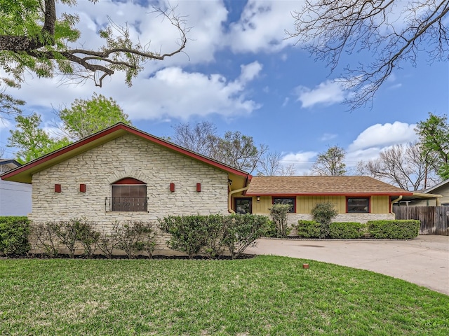 822 Hermitage Dr, Austin, TX 78753 - view of front of property with stone siding and concrete driveway
