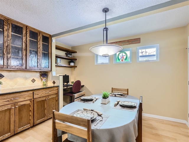 822 Hermitage Dr, Austin, TX 78753 - dining space with light wood-type flooring, plenty of natural light, and baseboards