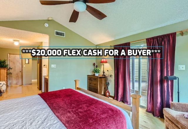 822 Hermitage Dr, Austin, TX 78753 - bedroom featuring lofted ceiling, wood finished floors, and a ceiling fan