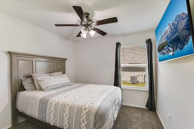bedroom with ceiling fan, baseboards, and carpet