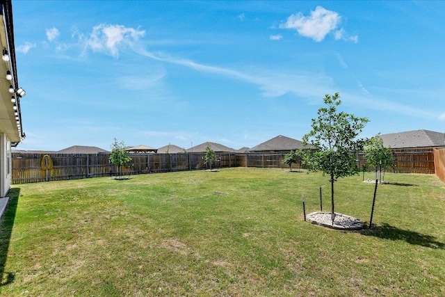 view of yard with a fenced backyard