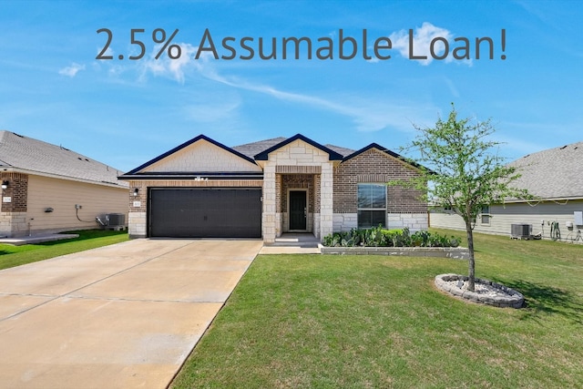 102 Reagor Dr, Taylor, TX 76574 - view of front of home featuring a garage, stone siding, a front lawn, driveway, and brick siding