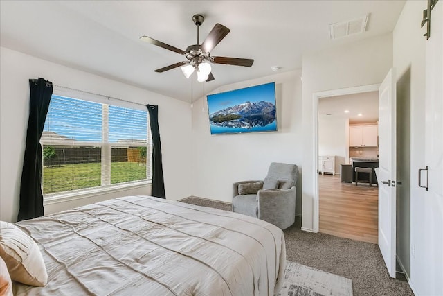 102 Reagor Dr, Taylor, TX 76574 - bedroom with carpet flooring and ceiling fan
