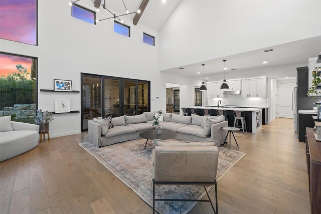 308 Rustling Wake Cv, Lakeway, TX 78738 - living area with a high ceiling and light wood finished floors