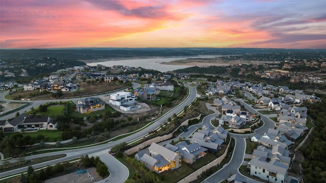308 Rustling Wake Cv, Lakeway, TX 78738 - aerial view at dusk of a residential view and a water view