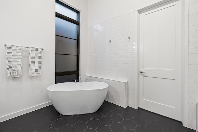 308 Rustling Wake Cv, Lakeway, TX 78738 - bathroom with a soaking tub and tile patterned floors